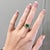This beautiful east west ring features a 1.67 carat emerald cut Emerald gemstone with a halo of natural earth mined...
