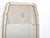 This mid century mirror with the Queen Anne shape, has a beveled mirror outer frame with gilt-wood edging, the split...