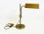The lamp is adjustable up and down and around its own axis. There is a patina on the metal surface. This piece has an...
