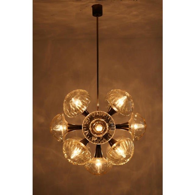 Large Sputnik Orbit Ceiling Lamp in Glass & Brass, 1970s, in Very Good conditions. Designed 1970 to 1979 Up to 250V...