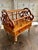 A charming 19th-century Victorian walnut Canterbury, crafted with elegant pierced side panels, turned supports, and a...