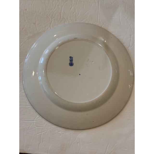 One of a set of 24 “Gibson Girl” plates, made by Royal Doulton, circa 1902-15. The series of 24 plates depicts the trials...