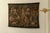 Wall tapestry produced in France. Woodcutters at work in a medieval setting. In good condition.