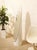 A playful postmodern floor mirror with a tall, elongated silhouette and a curving frame that gives the piece its...