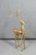 A striking vintage deer sculpture with an elegant, highly stylized modernist silhouette. The elongated body and...