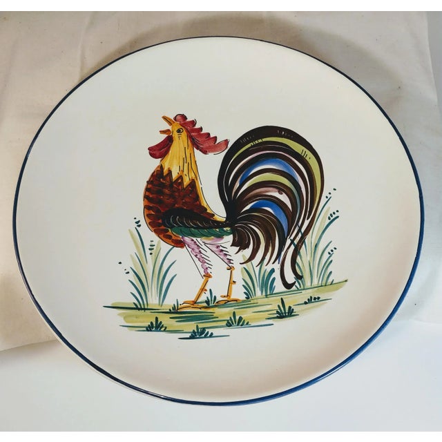 Vintage Italian rooster platter. Over-sized and handpainted, has a hole and wire hanger for wall display. This features a...