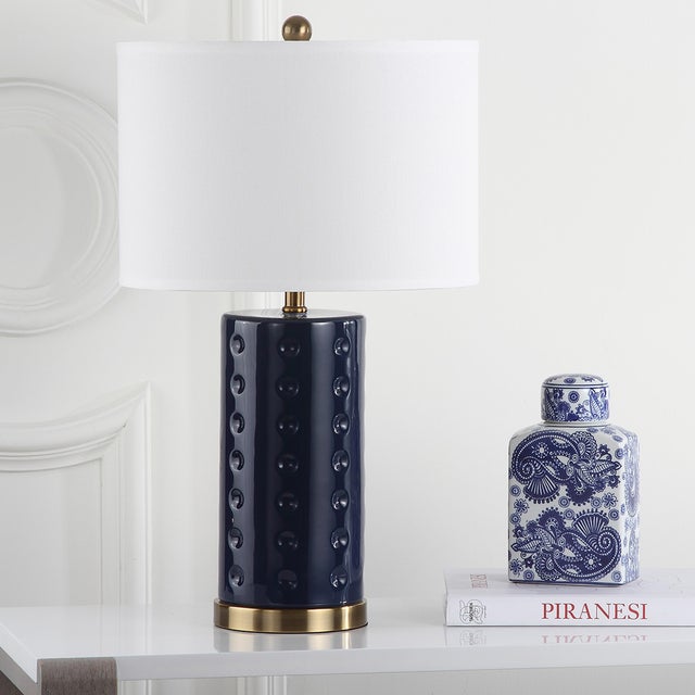 Graphic and geometric, the navy blue table lamp brings a bold touch of color to contemporary interiors. it's cylindrical...