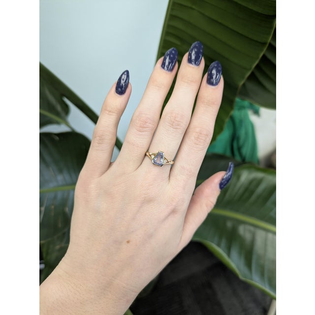 1.35ct Blue Sapphire Ring with Natural Diamond Accents Crafted in solid 14k gold, this sophisticated ring features a...