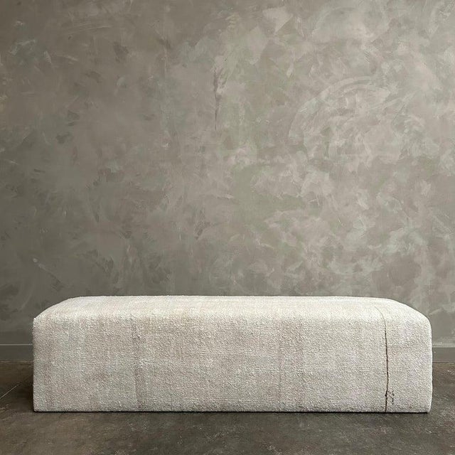 Custom made from a vintage turkish white hemp rug. We have customized this bench ottoman to fit at the foot of a king bed,...