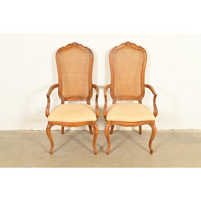 A gorgeous pair of French Provincial Louis XV style armchairs or dining chairs By Thomasville USA, Circa 1960s Sculpted...