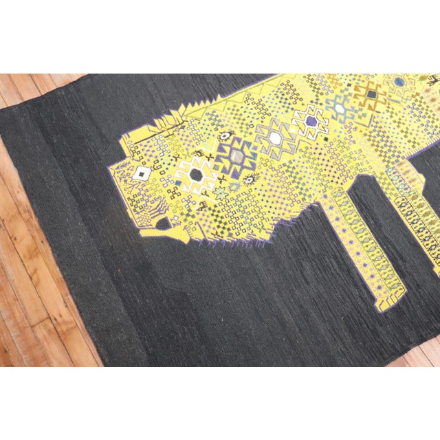 Accent size Persian Kilim from the late 20th century with a yellow lion featuring abstract elements with a gorilla face...