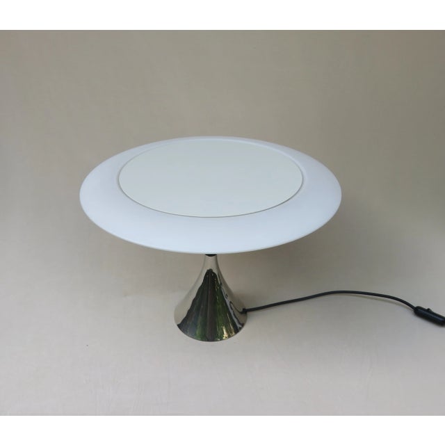 An exceptional and rare table lamp, UFO, from the 70s by Hillebrand. The light has 3 sockets E14. The pedestal is nickel-...