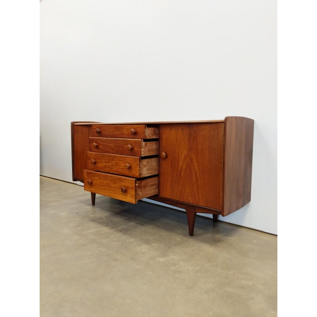 Authentic vintage mid century modern teak credenza / sideboard / console. Designed by John Herbert for A. Younger Ltd....