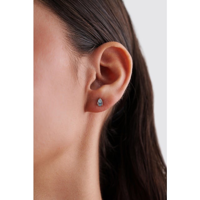 These elegant stud earrings feature 0.72 ct natural aquamarine, beautifully set in 14k yellow gold. Each gemstone measures...
