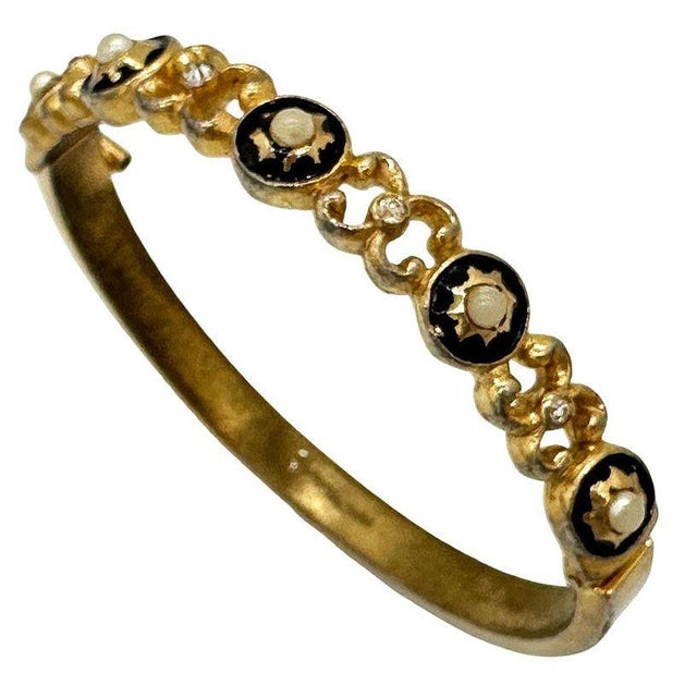 This Signed Castle Cliff Bracelet has black inlay with pearl studs, along with a chain design with jewels. It measures 2.5...