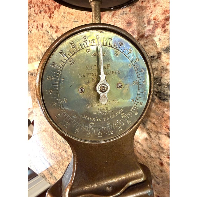 This is a Salter postal scale from England, with a capacity of 24 ounces, measured by the quarter ounce. It is a sturdy...