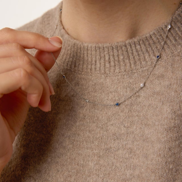 A refined and timeless vintage design, this elegant by-the-yard necklace features seven shimmering round brilliant...