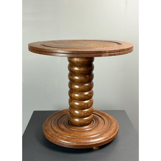 Lovely proportioned chunky wood turned low side table, France 1950s in the manner of Charles Dudouyt. This table is in a...