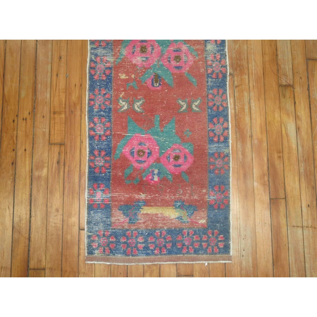 Mid-20th century turkish runner with an all over repetitive flower design. dated 1965 1'9'' x 9'1''