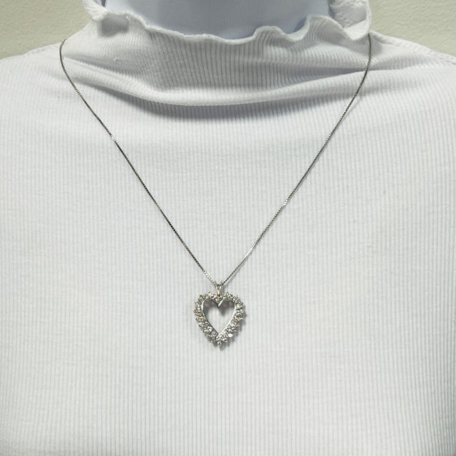 Beautiful 1.00 ct. good quality, white, and bright diamond rounds. Handmade in 14k white gold. Length of chain is 24".