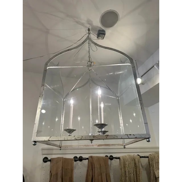 This is a Niermann Weeks Gothic Lantern in a custom size. This piece has a hand applied silver leaf finish with 3 bulbs....