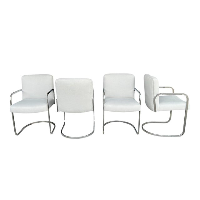 This exceptional set of four Mid-Century Modern cantilever dining chairs beautifully captures the sleek sophistication and...