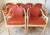 Wonderful set of nine McGuire rattan and cane club chairs. Rust colored vinyl upholstery. Leather wrapped. Each one has...