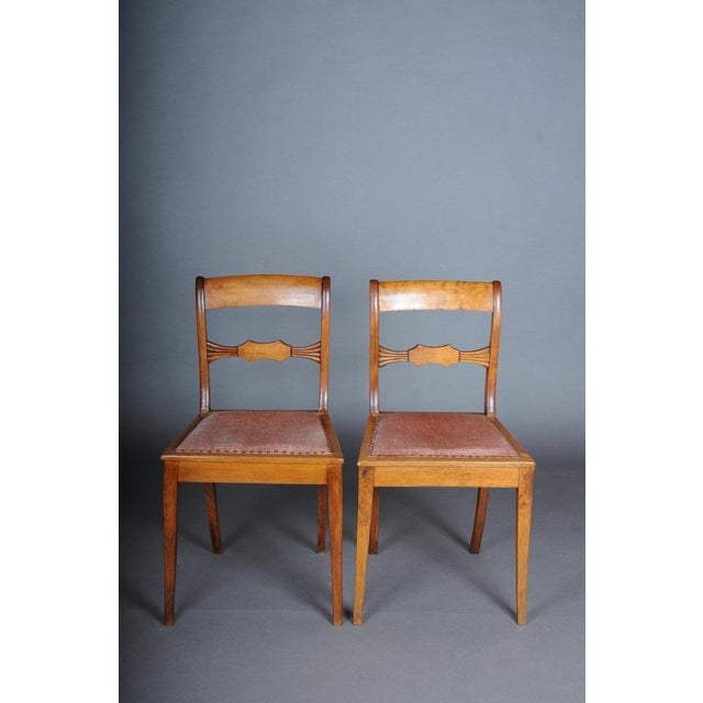 Solid birch wood body. Seat cushion upholstered and covered with fabric. Grand-line frame and legs. Slightly curved...