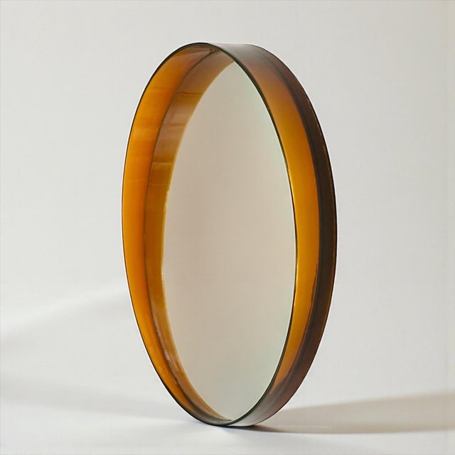 This French wall mirror was produced in the 1970s and exemplifies the sculptural language of Space Age design in Europe....