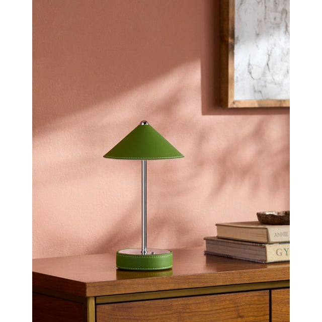 Illuminate your space with a touch of mid-century modern flair, courtesy of the Nomelle accent table lamp. Standing at an...