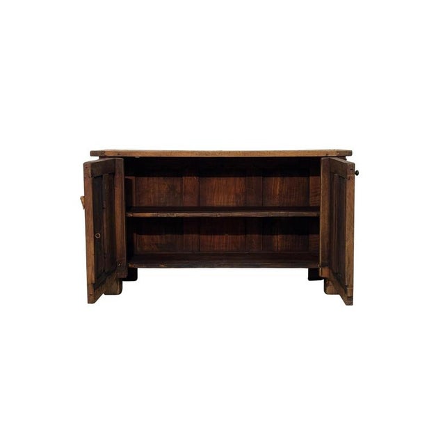 This antique 18th-century low sideboard, crafted from walnut, features an authentic rustic-Gothic style, where the...
