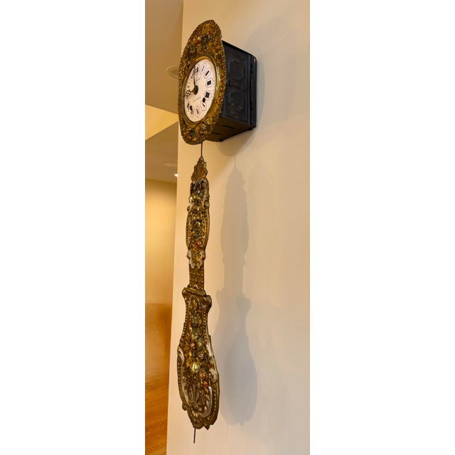 Stunning Morbier wall clock embodies the rustic elegance and artisanal craftsmanship of the Franche-Comté region. Named...
