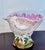 A striking antique English ceramic shell-form centerpiece modeled as a large shell resting on coral branches. The...