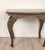 A John Wheatman custom copper top table with four antique legs.