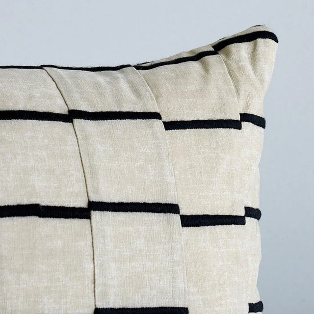 This pillow features Lines by David Kaihoi for Schumacher with a knife edge finish. This deceptively simple-looking fabric...