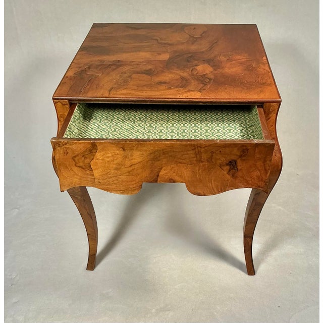This is a vintage Italian end/side table in a Louis XV style, featuring raised patchwork olive Burlwood veneer, single...