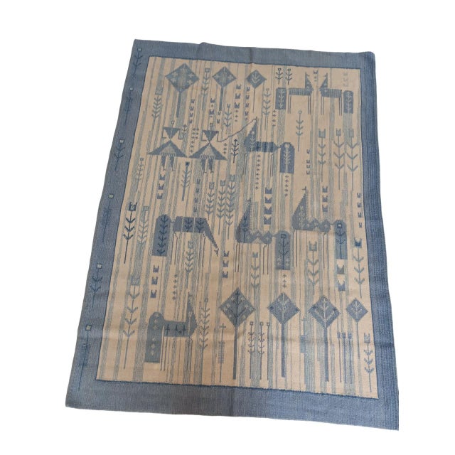Swedish tapestry rug from the 1960s attributed to Eva Nemeth with a stylized design, measuring 238 cm x 172 cm. The white...