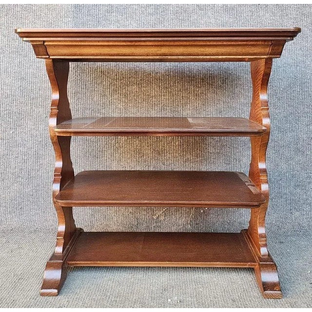 A Wood etagere with inlaid top and 3 open shelves. Dimensions: 26W 16.5D 26H
