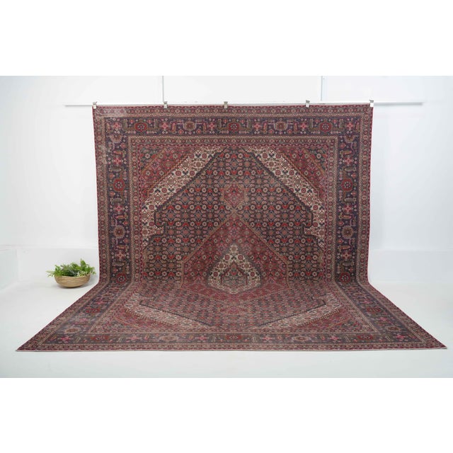 Vintage Persian Hand-Knotted area rug is a semi-antique vintage area rug. The '70s Eastern region of Persia's unique rug...