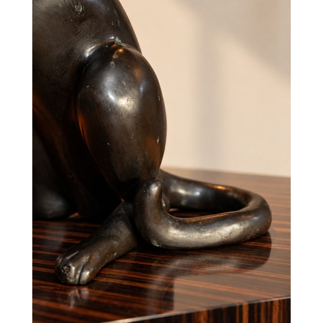 This imposing animal sculpture in genuine bronze is distinguished by its original and particularly expressive pose....
