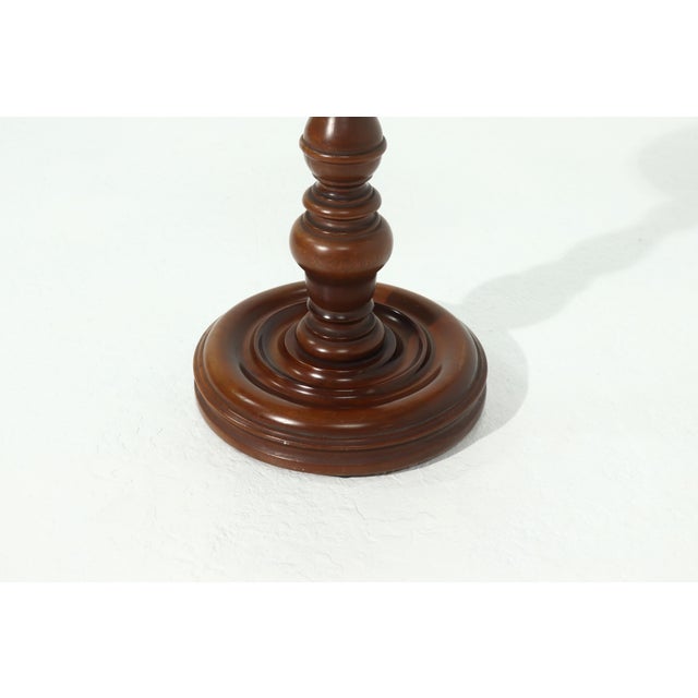 Solid wooden pedestal plant or side table from the 1960s. Nice piece with a decorative base.