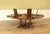 80- to 102-inch expanding round dining table that seats up to 12 people. This high-end, oversized planked table features...