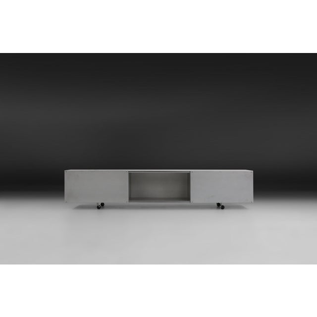 A rare and highly sought‑after example of maarten van severen’s early studio production, this lk94 sideboard was crafted...