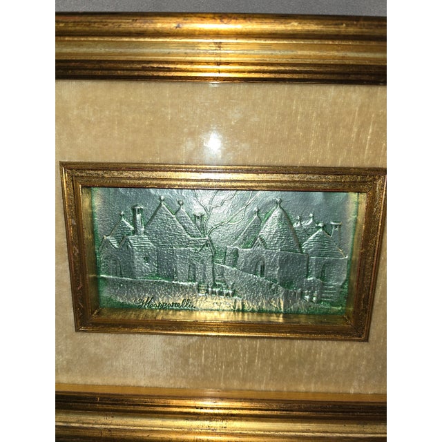 This is a beautiful metal relief of several buildings. This is by the Italian artist Mazzarelli Giuseppe. His signature is...