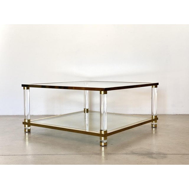 1970s coffee table, brass and plexiglas structure, 2 glass tops, a similar but smaller table is available if desired...