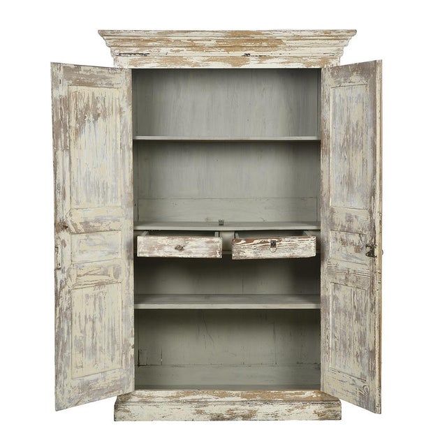 Large wardrobe with wooden interior drawers with white patina. This piece is designed in the style of the selected...
