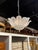 The Murano Frost Glass Leaf Flush Mount Chandelier is a warm white fixture featuring sculptural leaves. This fixture...