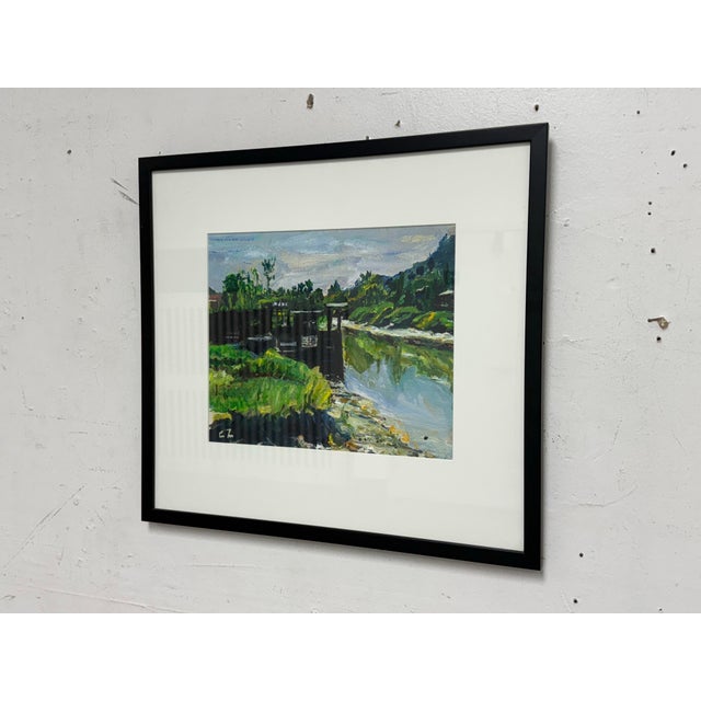 Design Plus Gallery presents an Original Artwork of Palette Knife Work of a Riverbend. The image shows a framed painting...