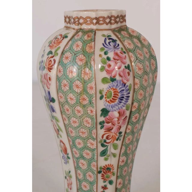 The smooth curve of this gorgeous vase is beautifully complimented by the vertical patterns adorning the exterior. These...