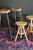 A set of 2 barley twist or spiral legged stools with rush round tops. Perfect for a counter or kitchen. Worn black painted...